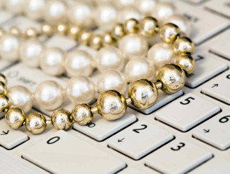 female freelancing pearls jewelry on a keyboard 2023 11 27 05 00 25 utc 1